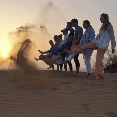 Tourists Playing in Iran Desert