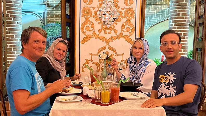 Tourists in an Iranian Traditional Restaurant